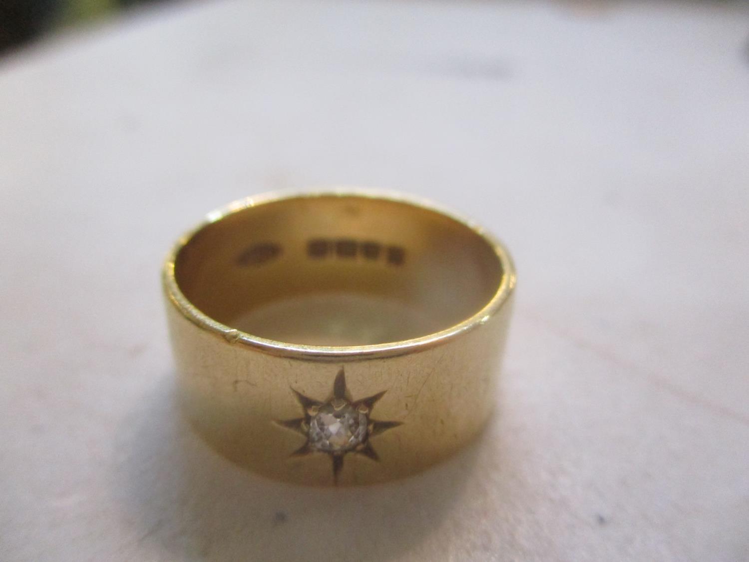 An 18ct gold diamond inset gypsy ring