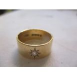 An 18ct gold diamond inset gypsy ring