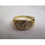 An 18ct gold gypsy ring inset with three diamonds