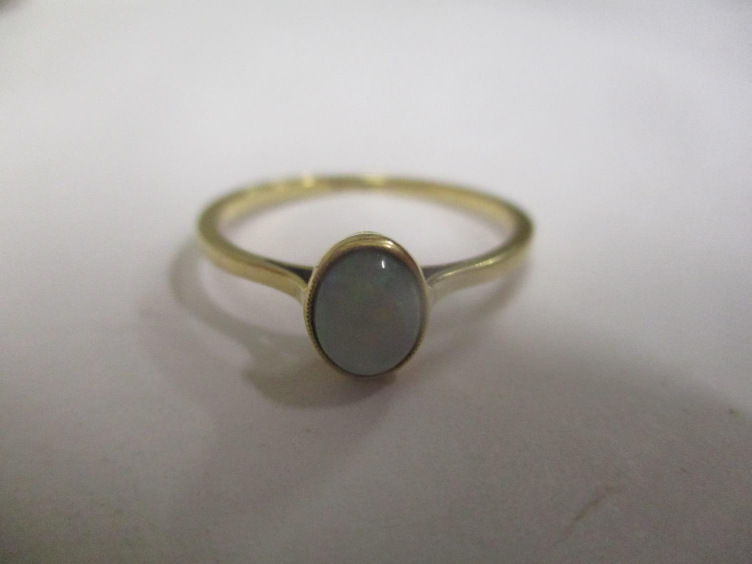 An 18ct gold opal inset ring