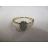 An 18ct gold opal inset ring