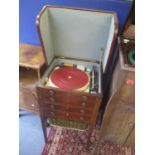 An early 19th century mahogany work table converted to a record player cabinet. Location:Front SR