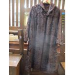 A vintage dark brown Astrakhan full length coat, 40" chest x 43" long