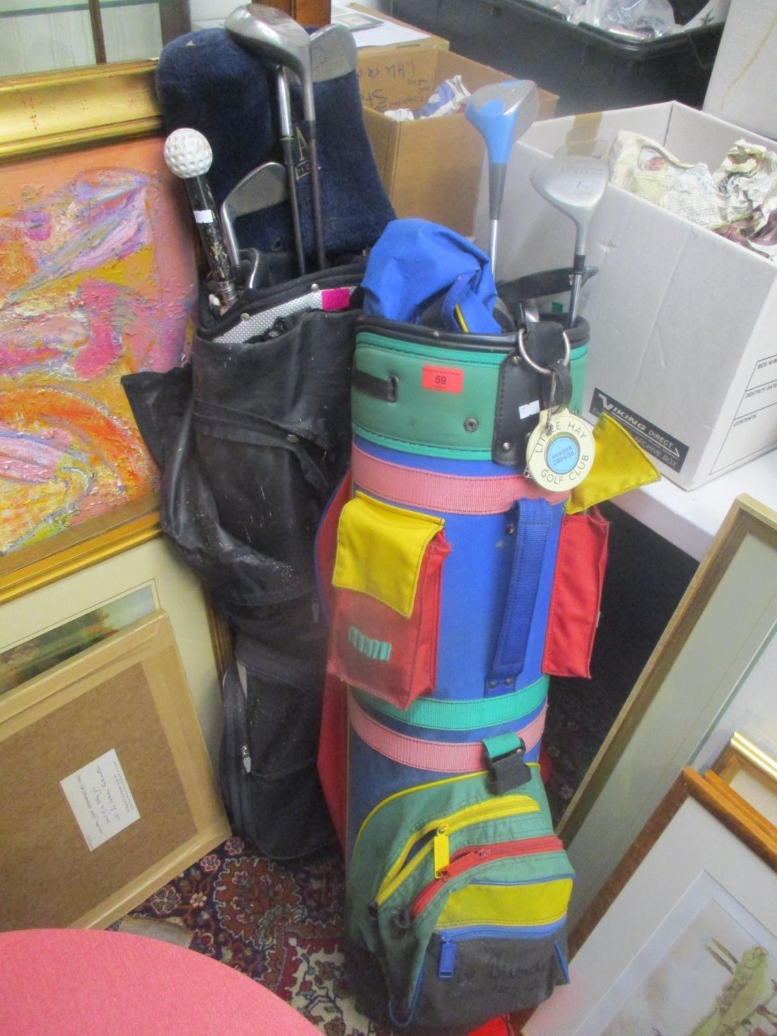 Two golf bags containing mixed golf irons