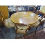 A Victorian walnut loo table with central pedestal, together with six walnut dining chairs