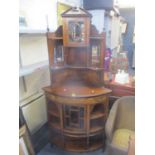A Victorian inlaid rosewood corner display cabinet with a glazed door and shelves above further