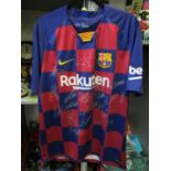 A Dri Fit Barcelona football shirt with un-authenticated signatures in silver marker pen, size large