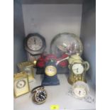 A quantity of late 20th century clocks to include a Panclox wall clock and carriage clocks Location: