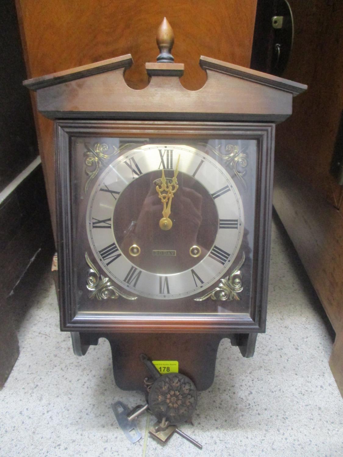 A reproduction mahogany finished 8-day wall clock. Location:BWR