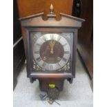 A reproduction mahogany finished 8-day wall clock. Location:BWR