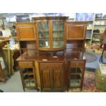 An Edwardian mahogany display side cabinet, the bow fronted top with twin glazed doors flanked by