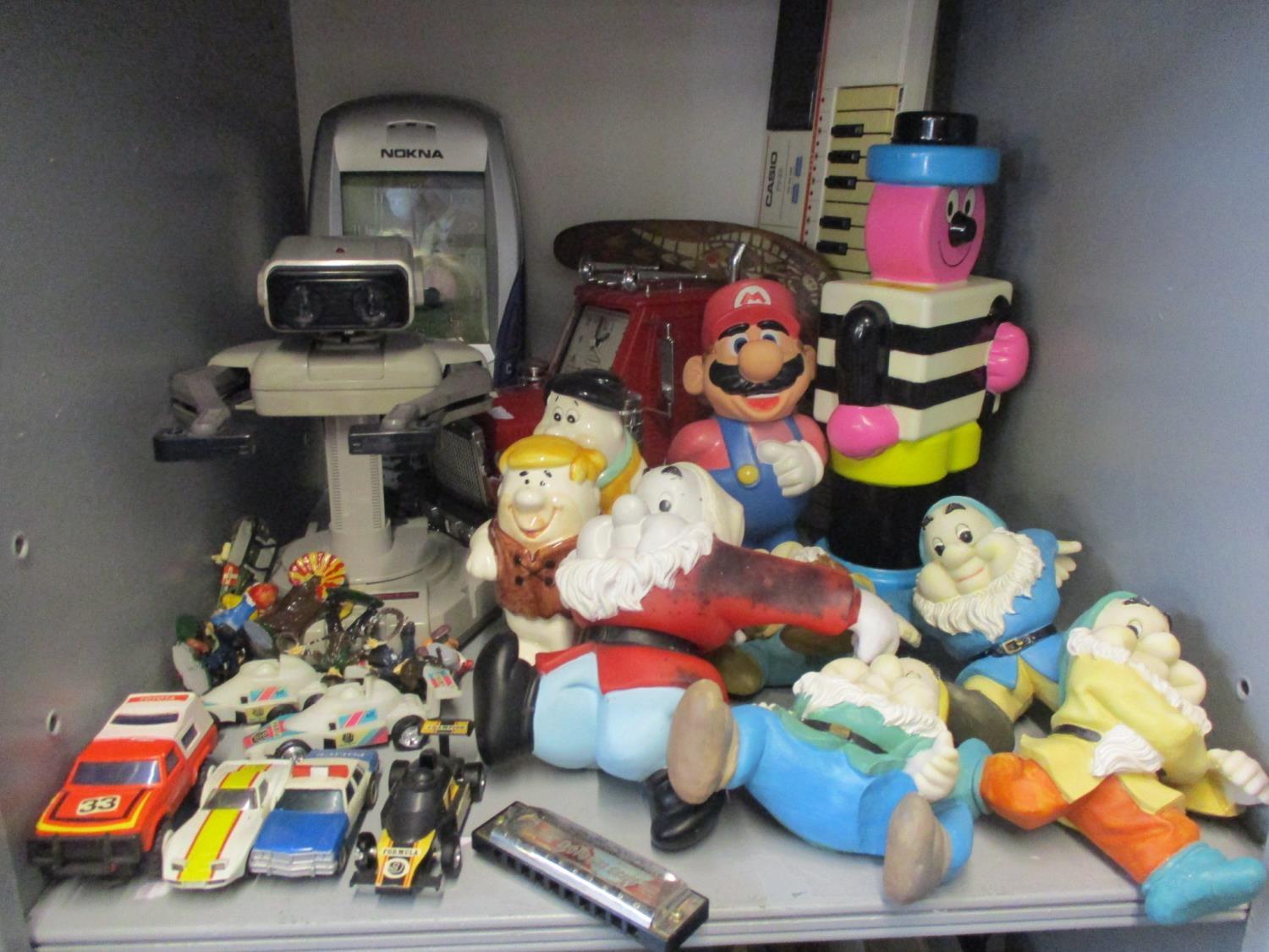 Late 20th century toys to include Snow White's dwarf models, a 1990s Nintendo model of Super Mario