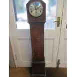 An oak cased grand-daughter clock Location: FOYER