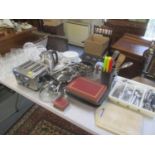 A selection of kitchen items to include cutlery, toaster, glasses, kettle and other items
