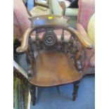 A Victorian mahogany Captains armchair having spindle supports and turned legs Location: RWM