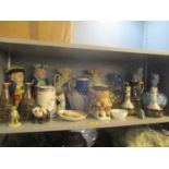 A mixed lot of china to include a Phoenix ware Celestine vase, Toby jugs, figurines of animals and