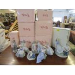 A collection of eight boxed Nao porcelain figures to include one of a couple talking