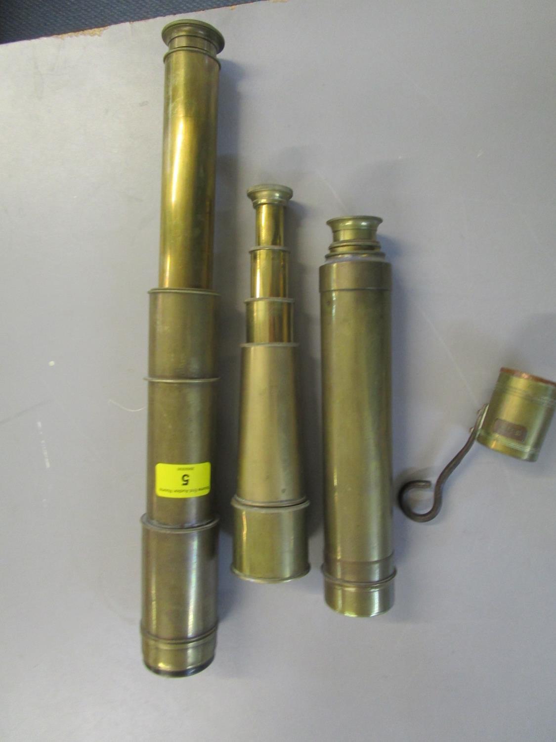 A Ross of London three drawer brass telescope no 21654, two other brass telescopes and a brass rum