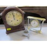 An Edwardian mahogany mantle clock with key, and two other clocks