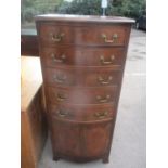 A reproduction mahogany bow fronted tallboy having five drawers above two cupboard doors 52 1/2"h