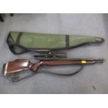 A Titan air rifle with a BSA scope and carry bag