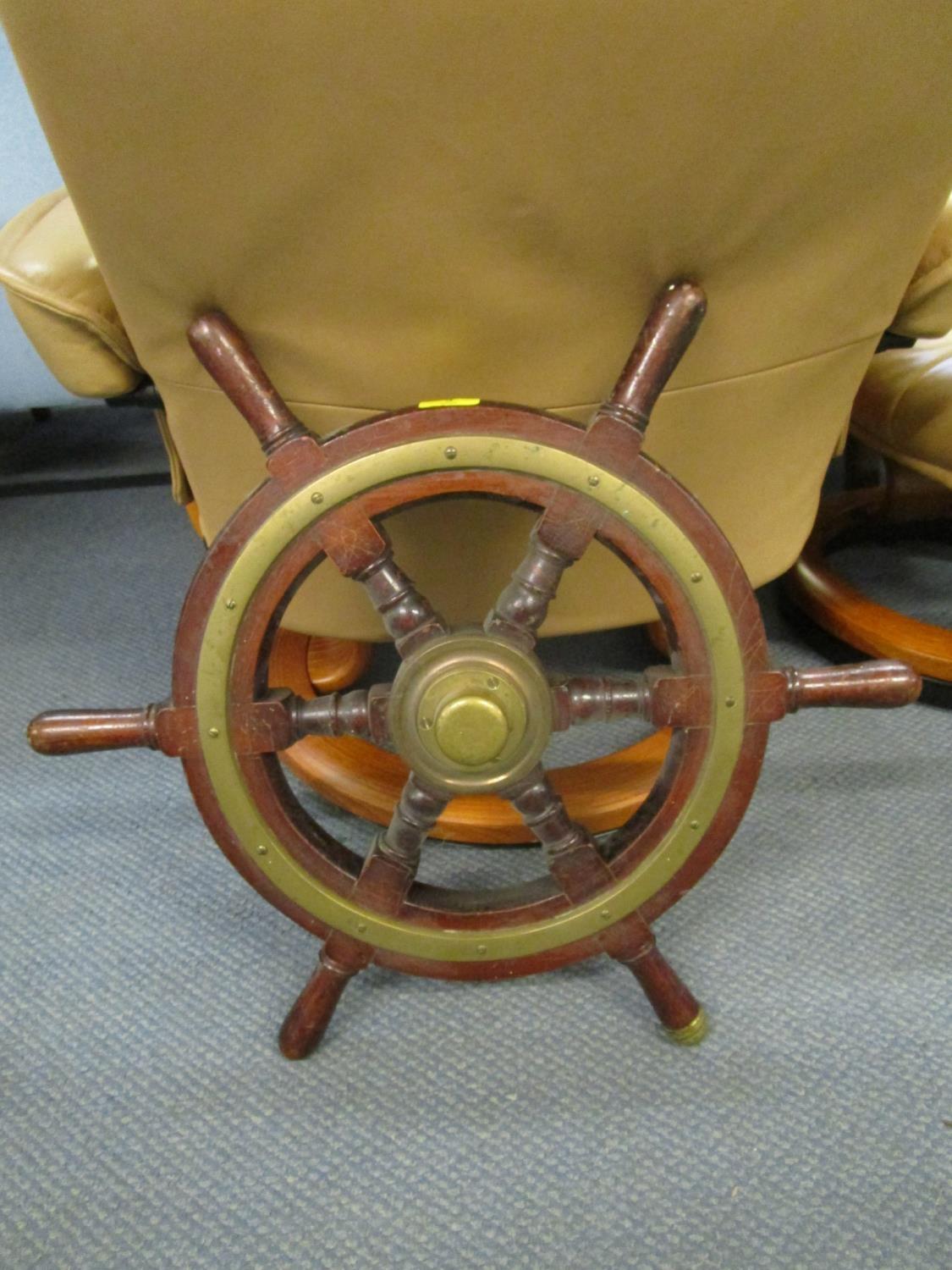 A vintage brass and wooden ships wheel Location: BWR