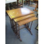 A nest of three rosewood reproduction tables, the larges 22 1/2"h x 21 1/4"w Location: 1:5
