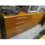 A mid 20th century G-Plan teak chest of eight short drawers, 30" h x 56"w