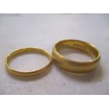 A pair of 22ct gold wedding bands Location: CAB