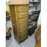 A modern American oak chest of seven drawers, on sturdy cabriole legs, 57" h, 21"w