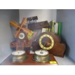 A treen clock in the form of a windmill, a 1940s mantle clock and a modern mounted barometer and