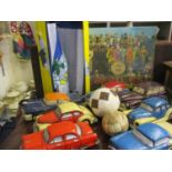 Seven papiermache painted models of American Classic cars to include a Chevrolet, together with