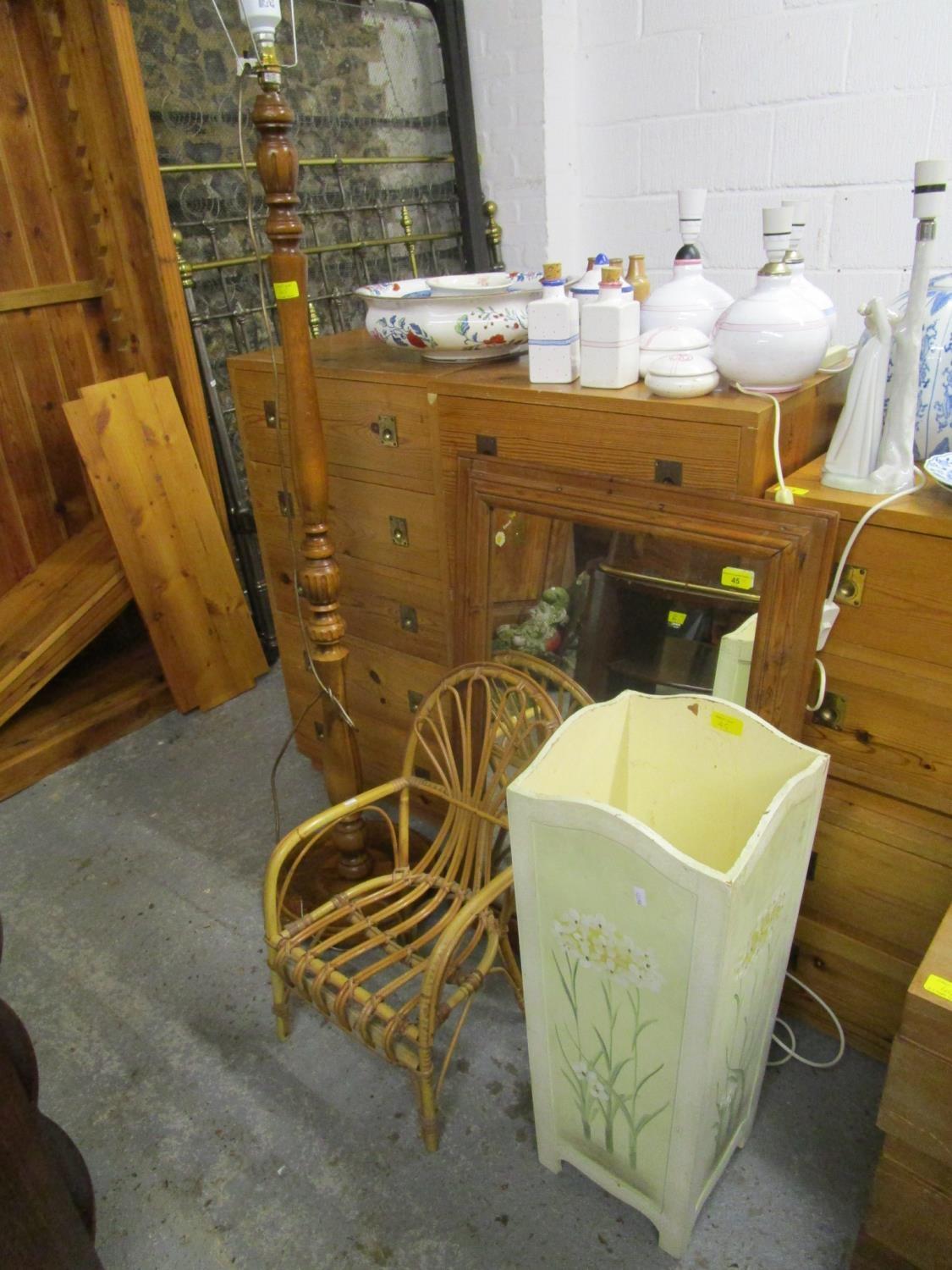 A contemporary pine wall mirror, small cane child's chair, a painted umbrella stand, a metal wine