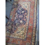 A Persian rug with a central medallion and flowering stems on a blue ground 70" x 47" Location: LAM