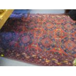 A Persian red ground rug having geometric designs with multiguard borders, 83" x 50 1/2"