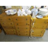 Two pine bedside chests of two drawers with inset brass handles, and two matching chests of five