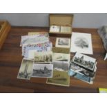 A selection of early 20th century postcards, some depicting the Empire State Building in New York