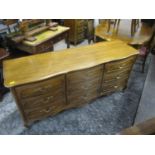 A modern American oak chest of nine drawers on cabriole legs, 81"h, 67" w