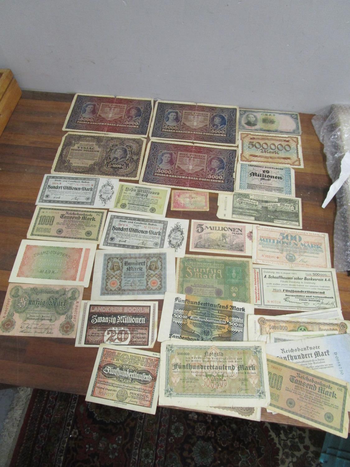 A quantity of early 20th Polish, German and Chinese bank notes