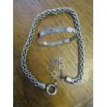 A fashion house style love bangle and a heavy metal modern fashion style chain necklace