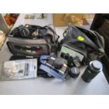 A Pentax Prograsso A camera in camera case with accessories and a Minolta x G2 camera with
