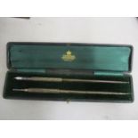 A cased white metal Sampson Mordan & Co pen and pencil