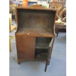 A burr elm open bookcase with two cupboard doors below, standing on bracket feet Location: LWM