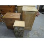 A pine pot cupboard with brass knop handle and plinth base, three pine boxes with carved decoration,