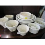 A mixed lot of pottery jelly moulds and mixing bowls Location: 11:5