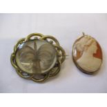 Two yellow metal brooches to include a cameo marked 14K. Location:Cab