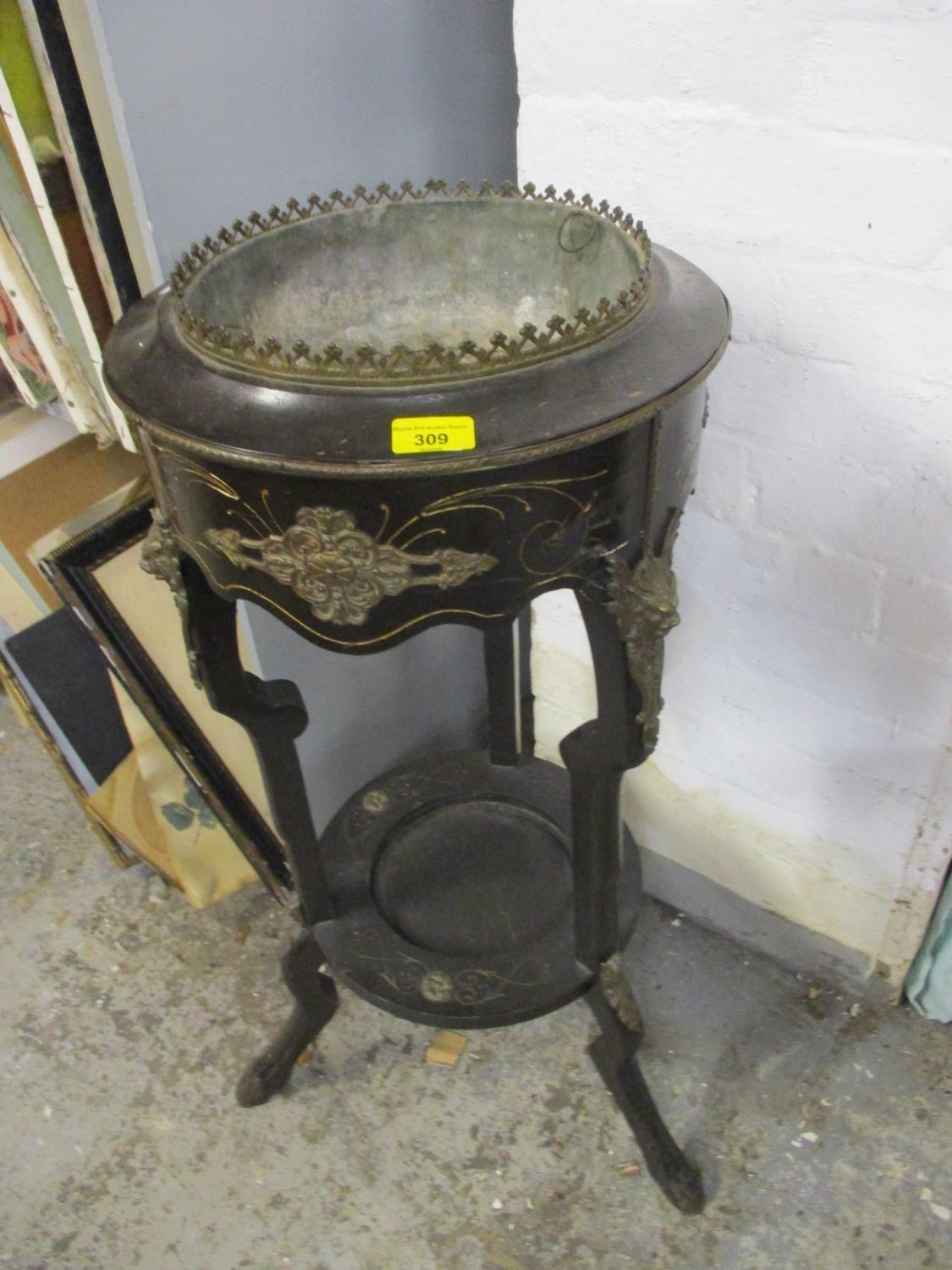 A 19th century ebonized, two tier plant stand