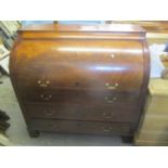A late 19th century French walnut cylinder bureau enclosing a slide and fitted interior above