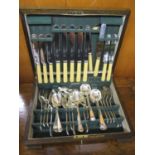 An early 20th century oak canteen of silver plated cutlery