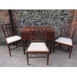 A mahogany side table, drop leaf with single drawers, together with three mahogany chairs